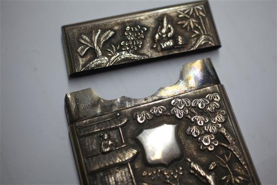 An early 20th century Chinese silver card case with embossed decoration and vacant cartouche, 10.4cm.